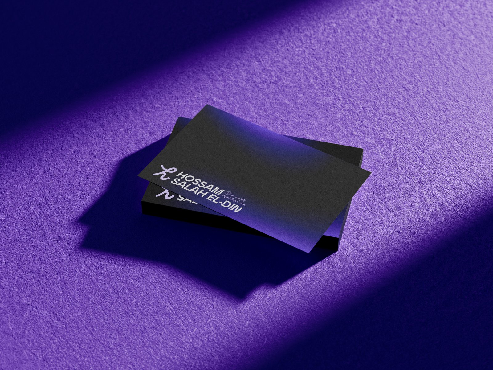 Hossam Salah El-Din business cards on purple textured surface